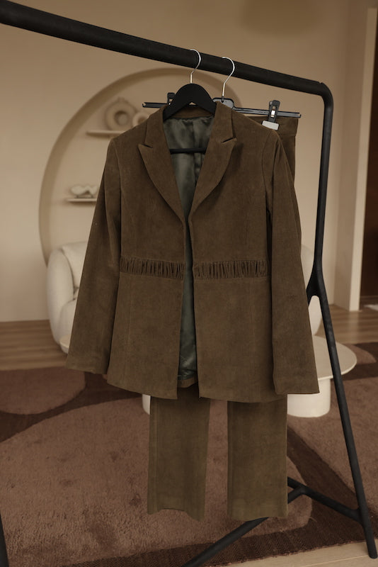 Green corduroy jacket with wrinkled detail